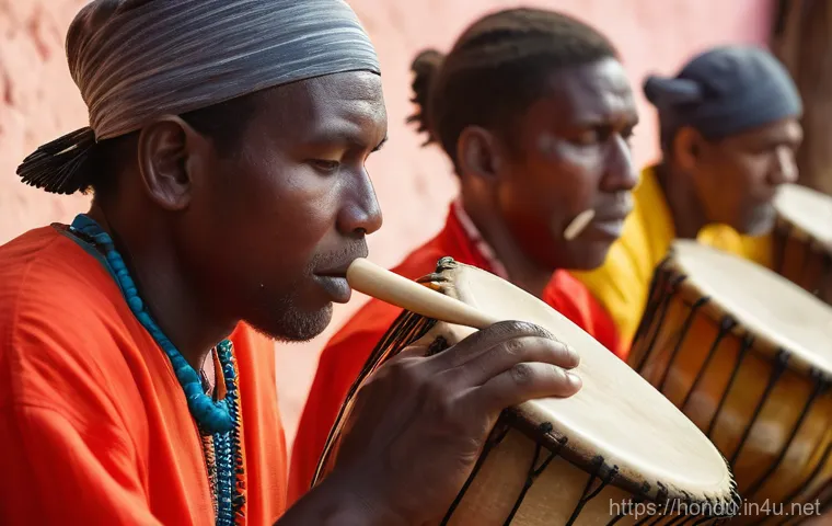 온두라스 전통 춤 푼타 - A dynamic wide shot of Garifuna people performing the traditional Punta dance on a sandy beach at su...